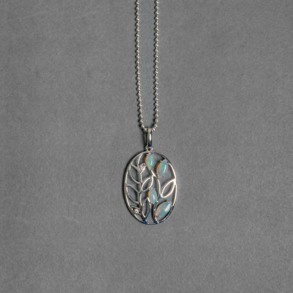 Stirling silver and solid opal pendant leaf detail.