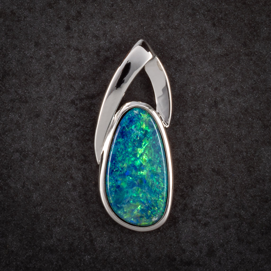 oval silver pendant with blue and green opal 