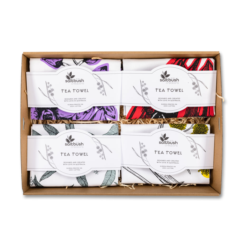 gift box containing 4 assorted vintage tea towels 