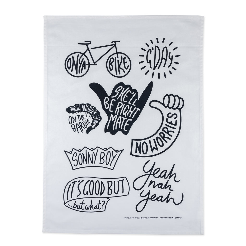 white and black tea towel labelled with different aussie sayings 