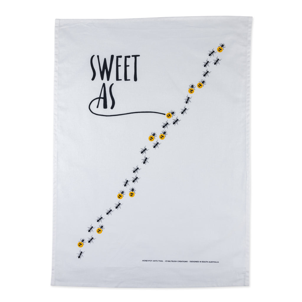 white tea towel with black and yellow honey ants reading sweet as 