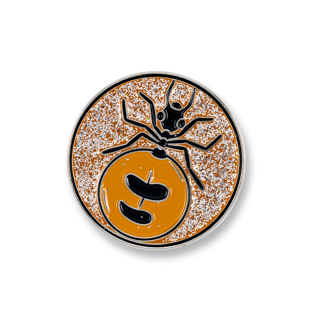round lapel pin with image of honey ant 